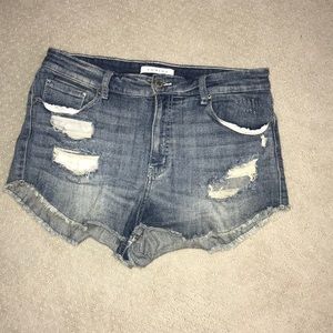 Light washed, ripped jean shorts.